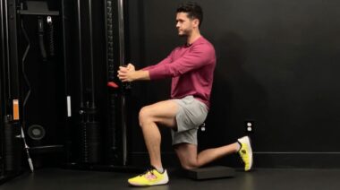 Coach James Shapiro demonstrating half-kneeling Pallof press